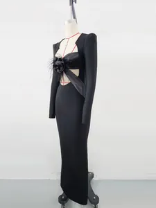 Detailed side view of black evening bandage dress with large feather flower accent