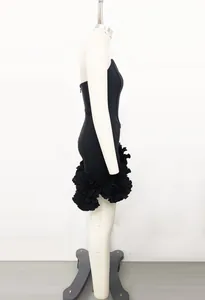 Side view of premium black bandage mini dress with elegant ruffled floral hem details