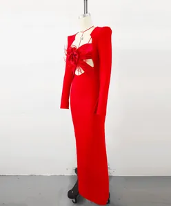 Red bandage evening gown with feather flower and cut-out detail on mannequin