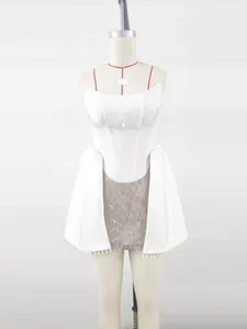 Elegant white corset dress with pearl beads and lace detail for wedding guest or party.