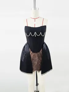 Elegant black corset mini dress featuring pearl detailing and lace skirt for parties