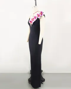 Side view of an elegant black one-shoulder bandage dress with pink orchid flowers