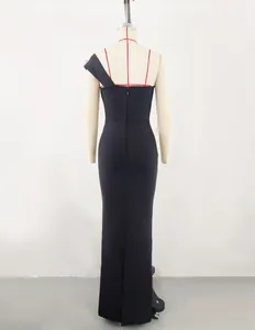 Back view of elegant black one-shoulder bandage evening gown on mannequin