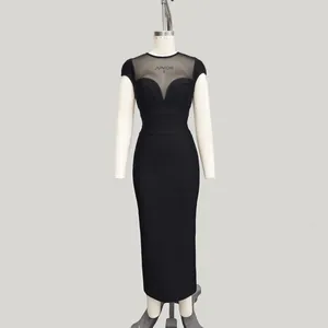 Elegante vestido lápiz negro de talle alto con retazos de malla y diseño estilo vendaje