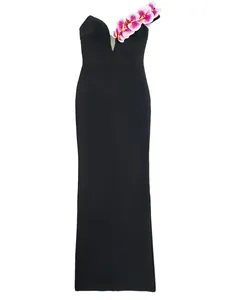 Detailed macro view of elegant black bandage dress with 3D orchid flower shoulder accent