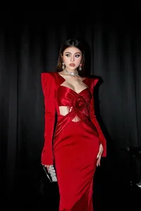 Elegant red satin bandage evening gown with feather rose detail for party events.