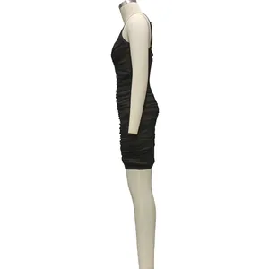 Side view detail of an elegant black mesh ruched bodycon mini dress for party wear