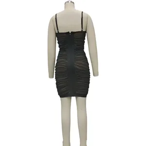 Rear view of black sexy bodycon dress with mesh ruched details and back zipper.