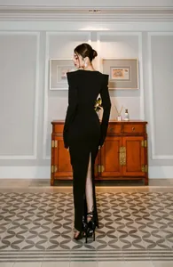 Back view of elegant black long-sleeve bandage evening dress with a stylish back slit.