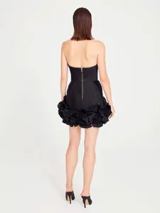 Elegant black strapless bandage mini dress featuring a voluminous floral ruffle cocktail hem