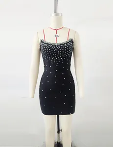 Elegant black bandage mini dress with sparkly rhinestone embellishments on mannequin