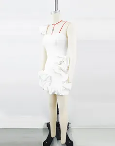Detailed side view of a white ruffle mini dress on a tailor mannequin for party wear.
