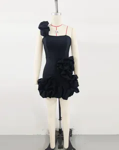 Full view of elegant black one-shoulder mini dress featuring large 3D floral rose accents