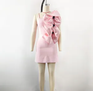 Elegant Barbie pink satin mini dress featuring dramatic oversized triple bow detail