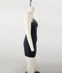 Close-up side view of a black bandage mini dress featuring sparkling silver rhinestones