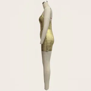 Side view detail of a gold metallic bandage dress showing the bodycon fit and texture.