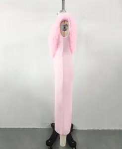 Side view of an elegant pink long bandage dress with luxury faux fur neckline detail.
