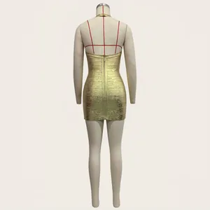 Back view detail of a sexy gold bandage mini dress with zipper on a mannequin display
