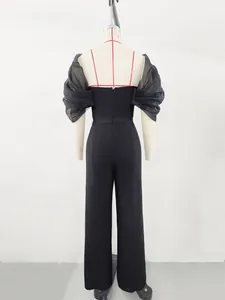 Back view detail of black off-shoulder jumpsuit with sheer organza puff sleeves