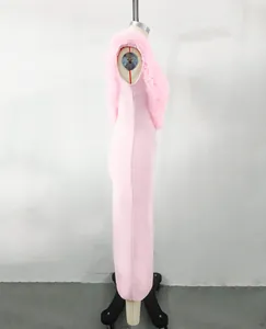 Side view of elegant pink bandage maxi dress with faux fur shoulder ruffles