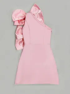 Detailed close-up view of the oversized pink satin bow on this one-shoulder dress