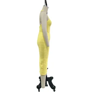 Side view detail of a lemon yellow halter bandage midi dress on a mannequin