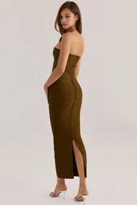 Side view of olive green glitter bandage dress showing bodycon fit and elegant slit.