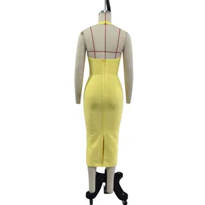 Back view detail of lemon yellow halter bandage dress showing zipper and split hem