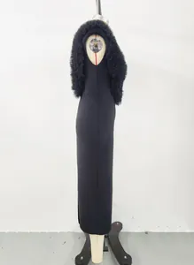 Side view of an elegant black ruffled shoulder bandage maxi dress on a mannequin