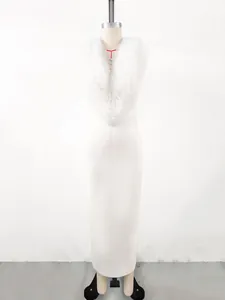 Close-up of the ruffled V-neck detail on an elegant white bandage evening dress
