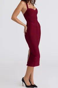 Side view of the bandage texture and silhouette of a wine red halter midi dress