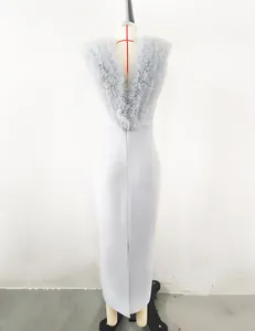 Detailed back view of a grey bandage dress featuring elegant ruffle tulle flower trim