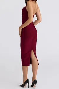 Elegant burgundy halter bandage dress with back slit shown from a back-three-quarter view