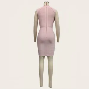 Detailed back view of a soft pink sleeveless bandage evening dress displayed on a mannequin
