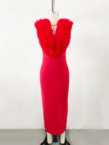 Detail view of an elegant red bandage maxi dress with a ruffled V-neck tulle collar.