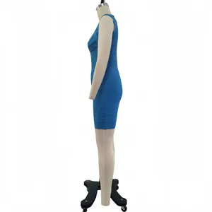 Detail side profile of sea blue sparkling gold bandage bodycon dress on a mannequin