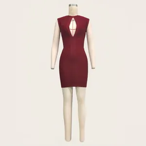 Detail view of burgundy sleeveless keyhole bandage dress with textured ribbing