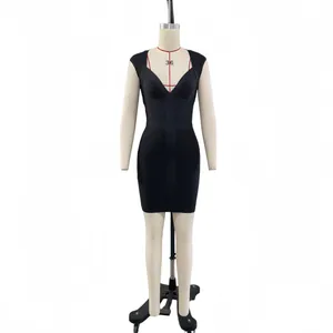 Detailed view of a black V-neck sleeveless knit bandage evening dress on a mannequin