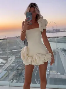 One-shoulder white mini dress with oversized 3D ruffles for party and evening wear