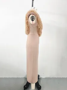 Side view of an elegant pink bandage dress with ruffled mesh shoulders on a mannequin.