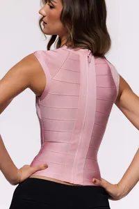 Detailed back view of a pink bandage sleeveless top featuring a functional hidden zipper.