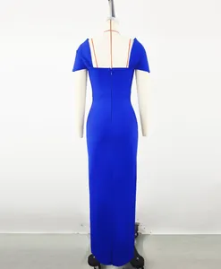 Detailed back view of an elegant royal blue floor-length bandage evening gown on a mannequin