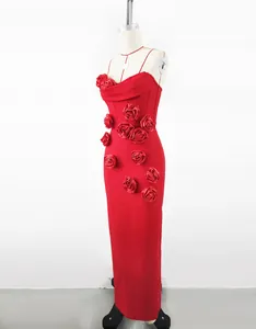 Detail view of red French style evening dress with 3D rose floral appliques for weddings.