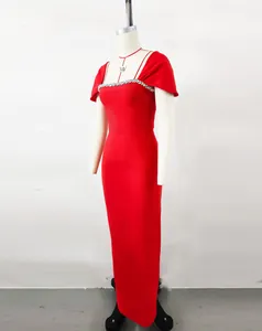 Elegant red bandage evening gown with rhinestone neckline detail on mannequin display