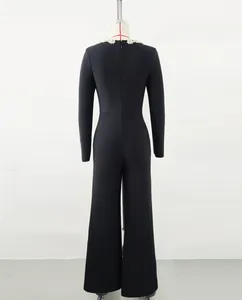 Back view of elegant black long sleeve jumpsuit with shimmering rhinestone collar detail