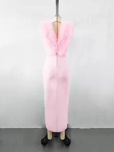 Elegant pink long bandage dress featuring exquisite ruffled flower detail on the back