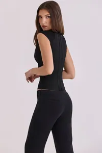 Back view of a black slim-fit bandage top featuring a full-length zipper and textured bands.