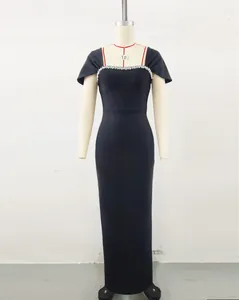 Detailed view of an elegant black bandage evening gown with luxury rhinestone collar.