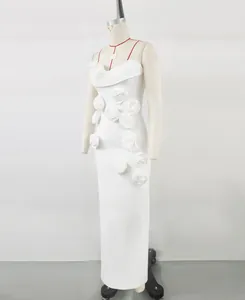 Elegant white mermaid dress with intricate 3D fabric flower appliqués on a mannequin