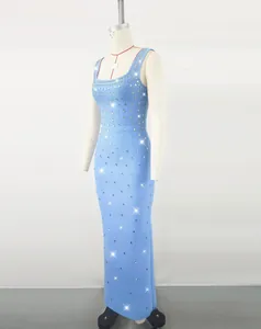 Close-up detail of a light blue evening bandage dress with sparkling rhinestone accents